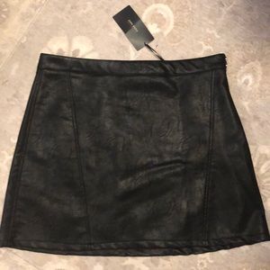 Black faux leather mini skirt. From Zara.